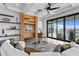 Bright living room with large windows and comfortable seating at 490 Laguna Dr, Tierra Verde, FL 33715