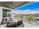 Relaxing balcony with water views and comfortable seating at 490 Laguna Dr, Tierra Verde, FL 33715