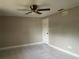 Simple bedroom with neutral walls and tiled floors at 65 Ventura Dr, Dunedin, FL 34698