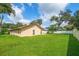 Expansive back yard with lush greenery and a well-maintained lawn at 1105 Deer Run Pl, Valrico, FL 33594