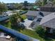 A spacious backyard, enclosed by a white fence, features a screened-in porch and mature trees, providing ample outdoor living space at 1105 Deer Run Pl, Valrico, FL 33594