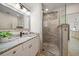 Updated bathroom features a glass enclosed shower with decorative tile at 1105 Deer Run Pl, Valrico, FL 33594