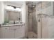 Updated bathroom features a glass enclosed shower with decorative tile at 1105 Deer Run Pl, Valrico, FL 33594