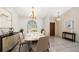 Bright dining room featuring a formal table and chairs set, arched window, and contemporary style at 1105 Deer Run Pl, Valrico, FL 33594