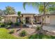 Inviting front entrance showcasing a well maintained lawn, mature landscaping, and a cozy sitting area at the front door at 1105 Deer Run Pl, Valrico, FL 33594