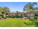 Charming home with a beautifully landscaped front yard and mature trees, providing shade and curb appeal at 1105 Deer Run Pl, Valrico, FL 33594