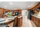 Large kitchen boasts granite countertops, stainless steel appliances, custom cabinets, and an island perfect for entertaining at 1105 Deer Run Pl, Valrico, FL 33594