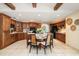 Spacious kitchen featuring wood cabinets, central island with seating, and stainless steel appliances at 1105 Deer Run Pl, Valrico, FL 33594