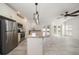 Open kitchen featuring an island, granite countertops and stainless steel appliances at 1105 Deer Run Pl, Valrico, FL 33594