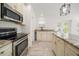 Bright kitchen features granite countertops, stainless steel appliances and tiled flooring at 1105 Deer Run Pl, Valrico, FL 33594