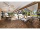Spacious screened patio with a dining table, comfortable seating, and relaxing lounge chairs at 1105 Deer Run Pl, Valrico, FL 33594