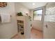 Shower stall with built in bench and shelving at 1105 Deer Run Pl, Valrico, FL 33594