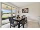 Dining area with access to the outdoor patio through sliding glass doors, offering seamless indoor-outdoor living at 11464 Chilly Water Ct, Riverview, FL 33569