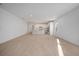 Large living room with views into the kitchen, recessed lighting, and wood look ceramic tile floors at 6216 Broad Field Ave, Apollo Beach, FL 33572