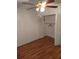 Bright bedroom featuring wood-look floors and closet at 8100 Dr Martin Luther King Jr N St # 208, St Petersburg, FL 33702