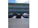 Two-story building with parking lot and cars at 8100 Dr Martin Luther King Jr N St # 208, St Petersburg, FL 33702