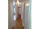 Hallway with light wood laminate flooring at 8100 Dr Martin Luther King Jr N St # 208, St Petersburg, FL 33702