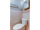 Pink tiled bathroom with toilet and shower/tub combo at 3123 Merita Dr, Holiday, FL 34691