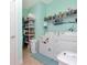 Laundry room with washer, dryer, and ample storage shelving at 6342 Kenava Loop, Palmetto, FL 34221