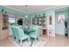 Bright dining room with light teal walls and a glass table at 6342 Kenava Loop, Palmetto, FL 34221