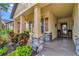 Covered porch with stone columns and potted plants at 6342 Kenava Loop, Palmetto, FL 34221
