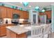 Kitchen with stainless steel appliances and granite countertops at 6342 Kenava Loop, Palmetto, FL 34221