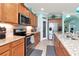 Island kitchen with stainless steel appliances and granite countertops at 6342 Kenava Loop, Palmetto, FL 34221