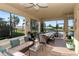 Spacious enclosed patio overlooking a lake, perfect for relaxation at 6342 Kenava Loop, Palmetto, FL 34221