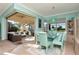 Bright dining room with glass table and seating for six at 6342 Kenava Loop, Palmetto, FL 34221