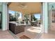 Relaxing enclosed patio with seating area and outdoor dining space at 6342 Kenava Loop, Palmetto, FL 34221
