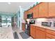 Modern kitchen featuring stainless steel appliances and light wood cabinets at 6342 Kenava Loop, Palmetto, FL 34221