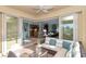 Spacious screened patio with comfortable seating and views of the living area at 6342 Kenava Loop, Palmetto, FL 34221