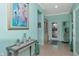 Bright teal entryway with decorative console table at 6342 Kenava Loop, Palmetto, FL 34221
