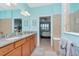 Double vanity bathroom with access to bedroom and shower at 6342 Kenava Loop, Palmetto, FL 34221