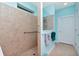 Walk-in shower with grab bars and neutral tile at 6342 Kenava Loop, Palmetto, FL 34221