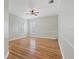 Light and bright bedroom with wood flooring and ceiling fan at 8809 Cross Landing Ln, Riverview, FL 33578