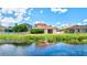 Home's backyard, pool and canal view at 7806 Grasmere Dr, Land O Lakes, FL 34637