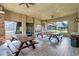 Covered outdoor seating area with picnic tables at 7806 Grasmere Dr, Land O Lakes, FL 34637