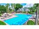 Large resort-style pool with plenty of lounge chairs at 7806 Grasmere Dr, Land O Lakes, FL 34637