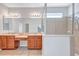 Bathroom with double sinks, large shower, and tile floors at 7806 Grasmere Dr, Land O Lakes, FL 34637