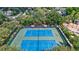 Two well-maintained tennis courts at 7806 Grasmere Dr, Land O Lakes, FL 34637
