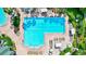 Luxury lap pool with plenty of lounge chairs at 7806 Grasmere Dr, Land O Lakes, FL 34637