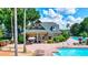 Resort-style pool area with clubhouse and lounge chairs at 7806 Grasmere Dr, Land O Lakes, FL 34637