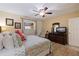 Main bedroom with king bed, TV and dresser at 18610 Gulf Blvd # 402, Indian Shores, FL 33785