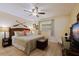 Main bedroom with king bed and ceiling fan at 18610 Gulf Blvd # 402, Indian Shores, FL 33785