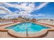 Inviting community pool with surrounding lounge chairs at 18610 Gulf Blvd # 402, Indian Shores, FL 33785