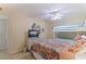 Full-size bed with a colorful bedspread and a bunk bed at 18610 Gulf Blvd # 402, Indian Shores, FL 33785