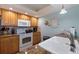 Well-equipped kitchen featuring granite counters and wood cabinets at 18610 Gulf Blvd # 402, Indian Shores, FL 33785