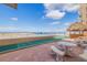Outdoor shuffleboard court and patio furniture at 18610 Gulf Blvd # 402, Indian Shores, FL 33785