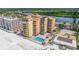 Relaxing patio area with tiki bar, tables, and beach views at 18610 Gulf Blvd # 402, Indian Shores, FL 33785